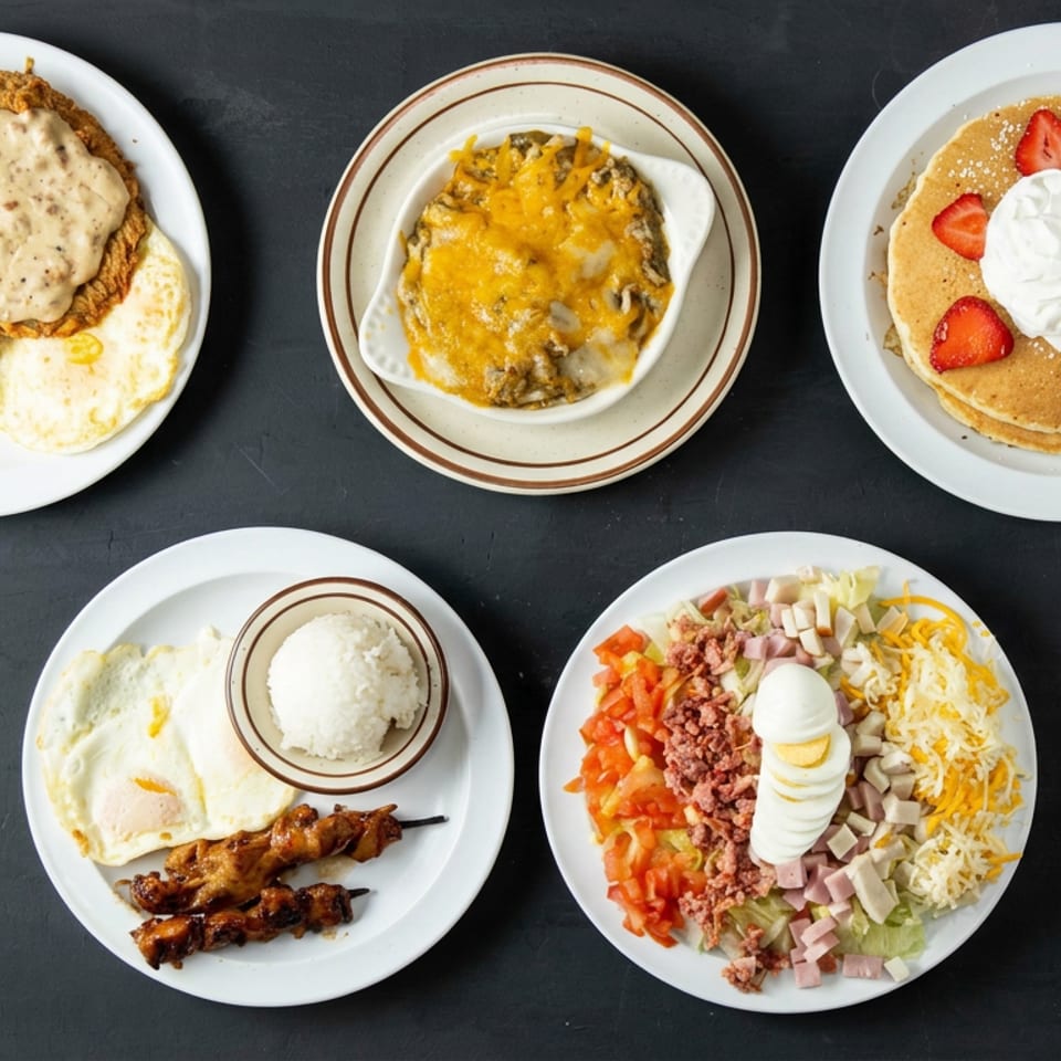 Five plated restaurant dishes include chicken-fried steak, cheesy casserole, strawberry pancakes, grilled skewers with rice, and a loaded salad.